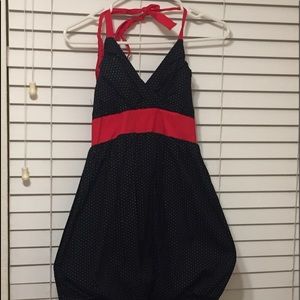 Used polkadot dress with red tie in the back.